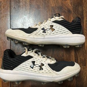 Black and white under armor cleats